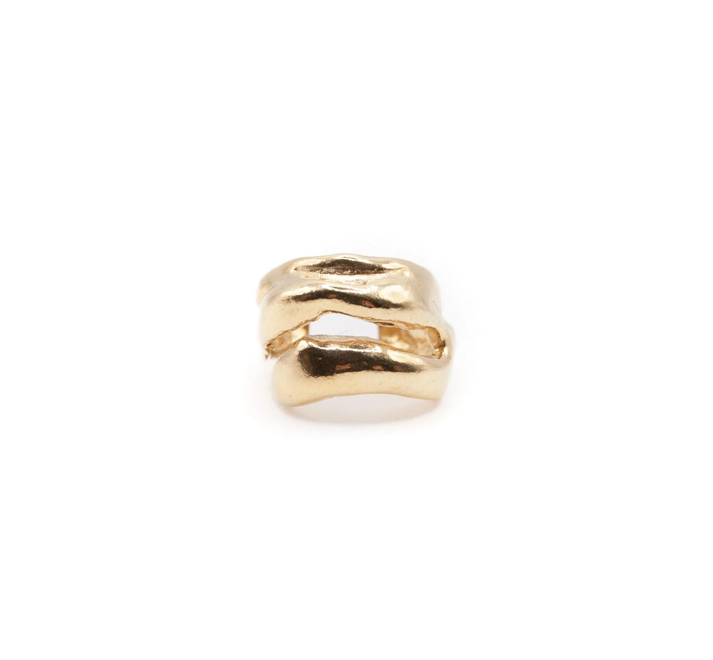 Chunky gold ear cuff with textured, organic design on white background