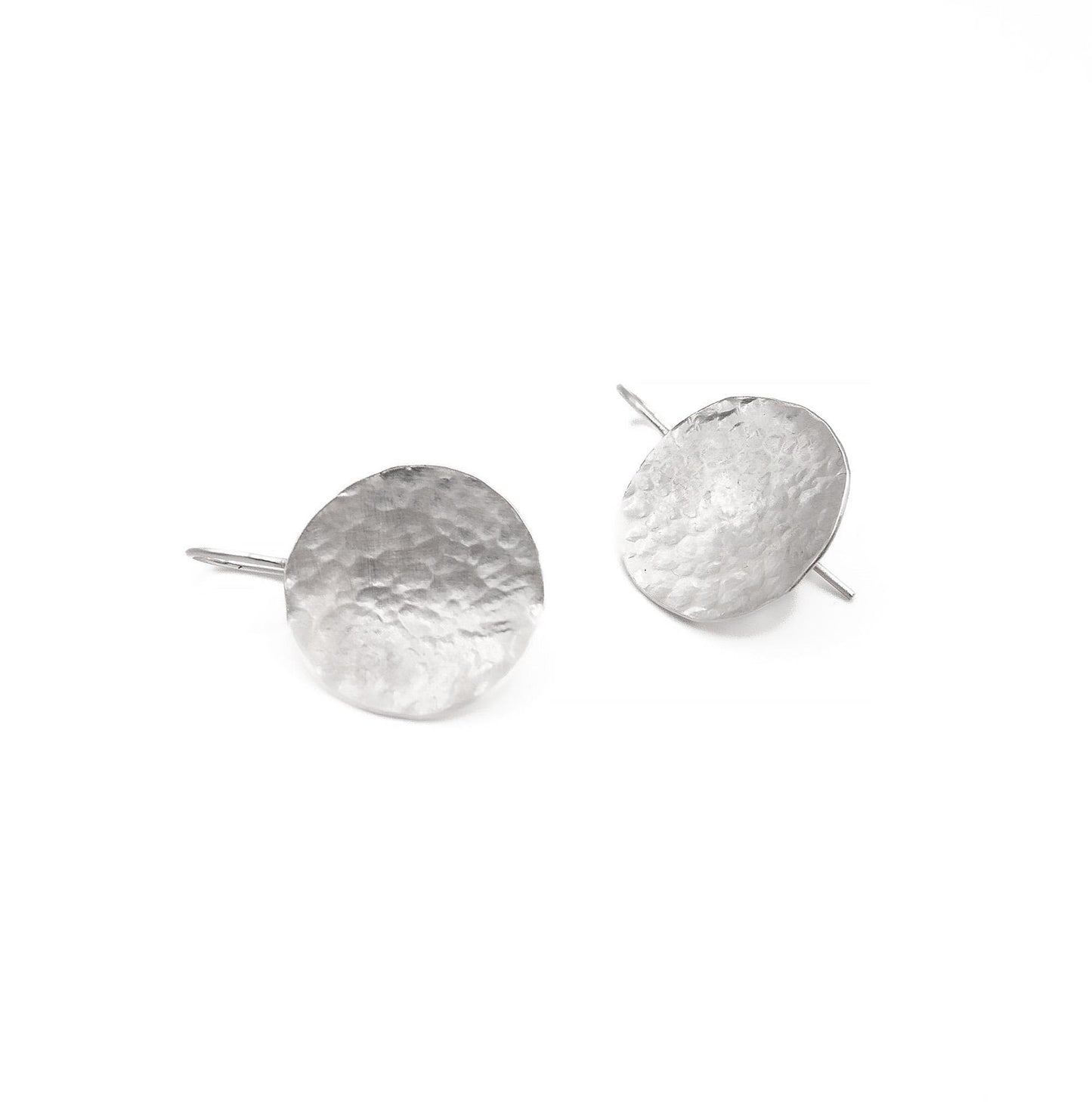 Hammered silver disc earrings with minimalist design on white background