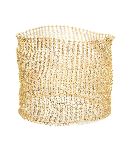 Gold woven basket on a white background