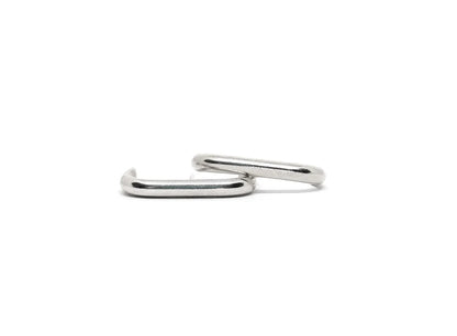 Pair of minimalist sterling silver ear cuffs on a white background