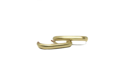Minimalist gold hoop earrings, matte finish, modern jewelry on white background