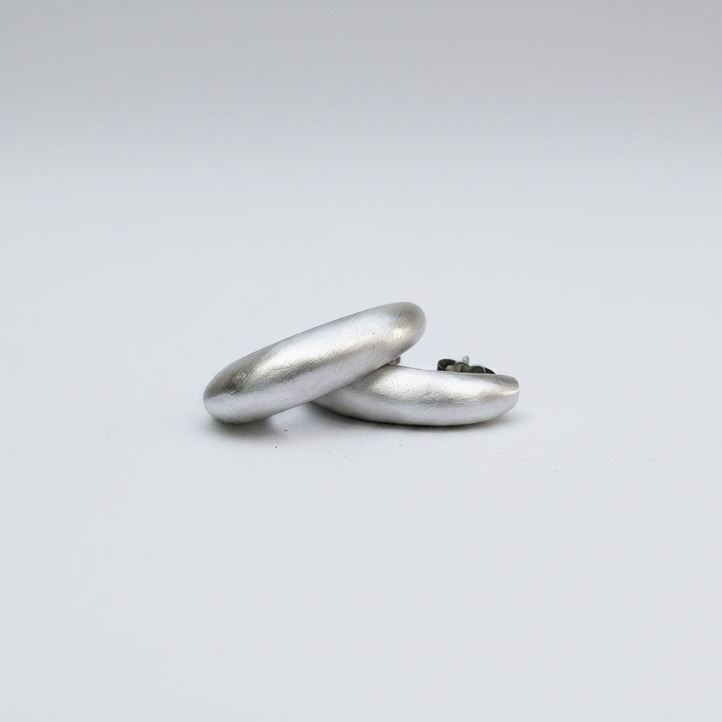 Two silver rings on a white background
