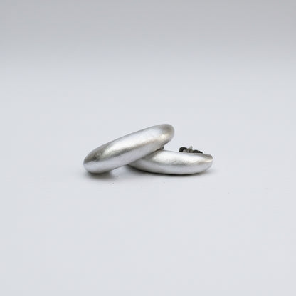 Two silver rings on a white background