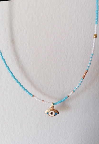 Necklace with an eye pendant on a white background