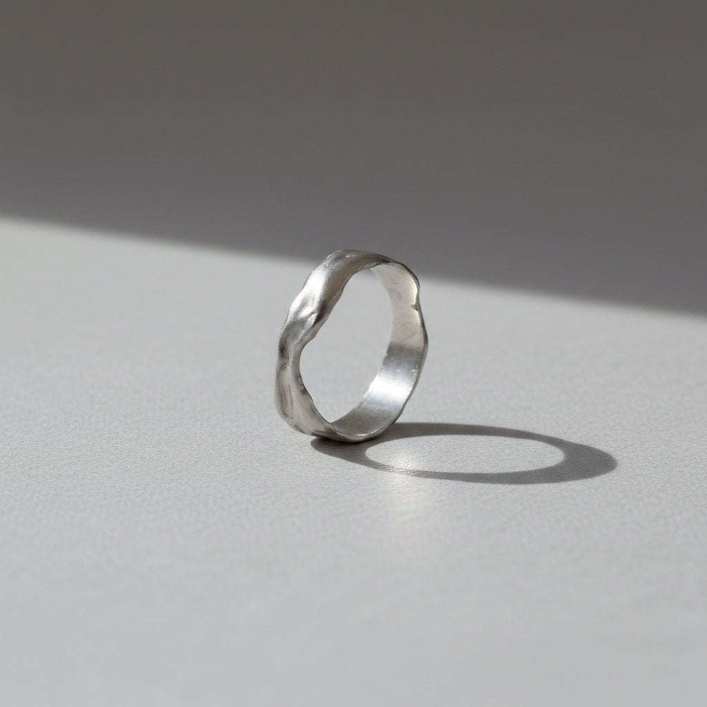Silver ring on a white background