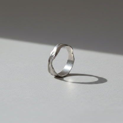 Silver ring on a white background