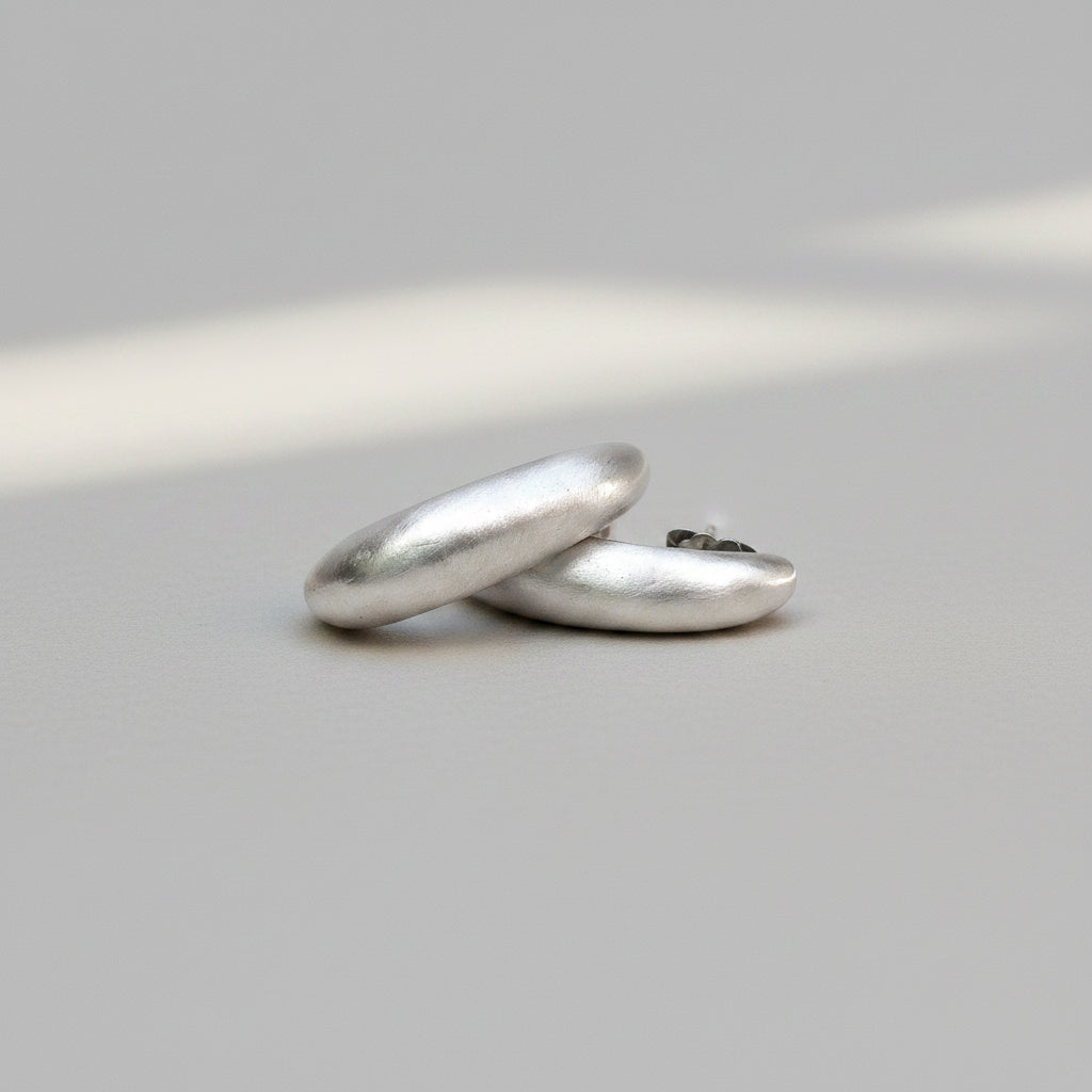Two silver rings on a white background