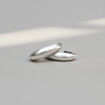 Two silver rings on a white background