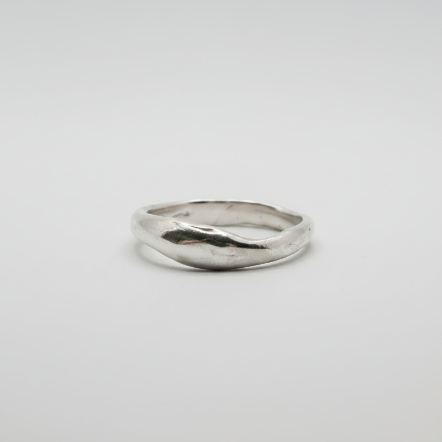 Silver ring on a white background