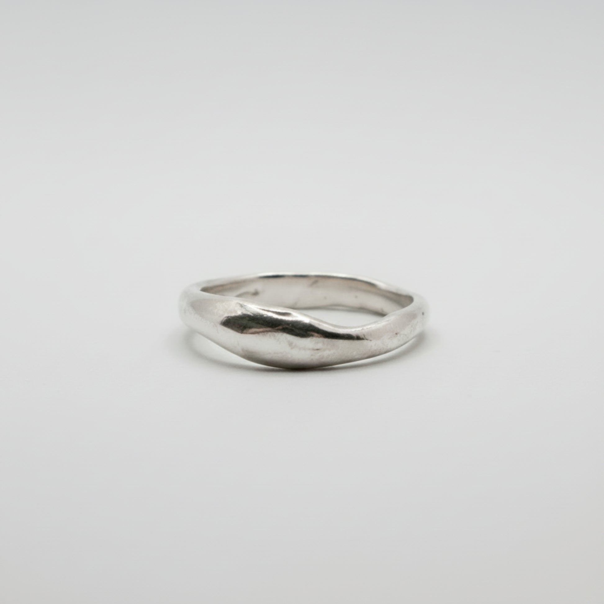 Silver ring on a white background