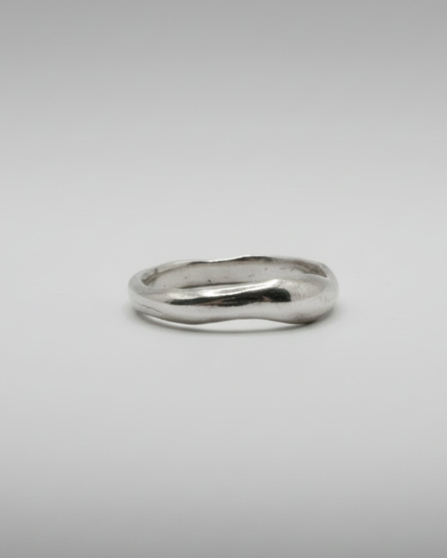 Silver ring on a white background
