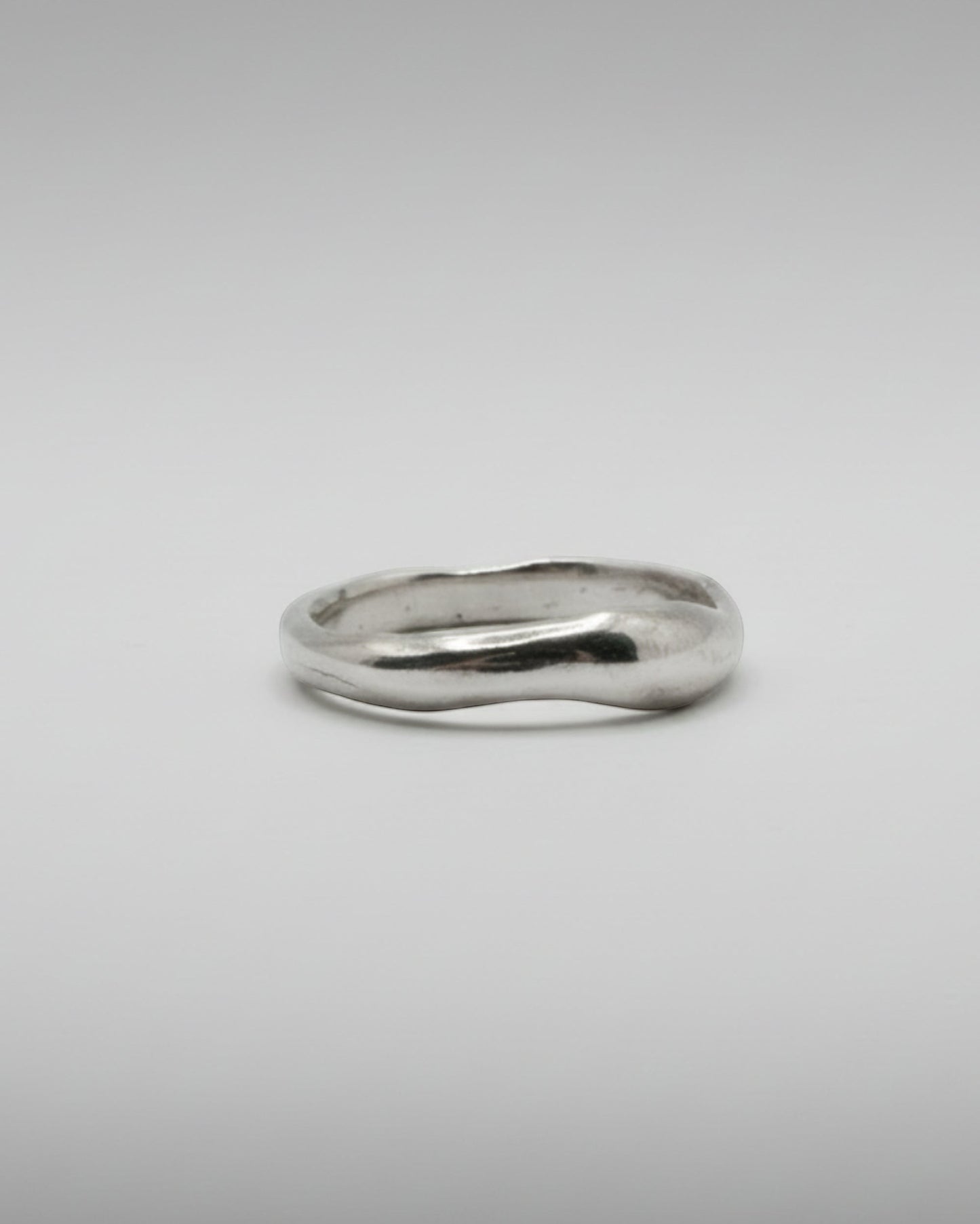 Silver ring on a white background