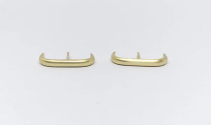Minimalist gold bar stud earrings on white background