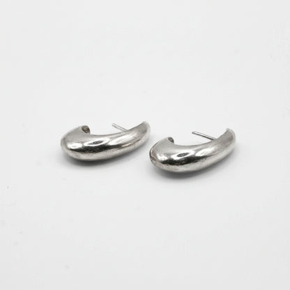 Pair of silver hoop earrings on a white background