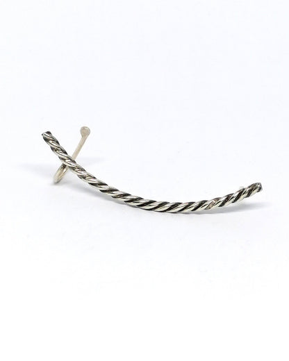 Silver earring on a white background