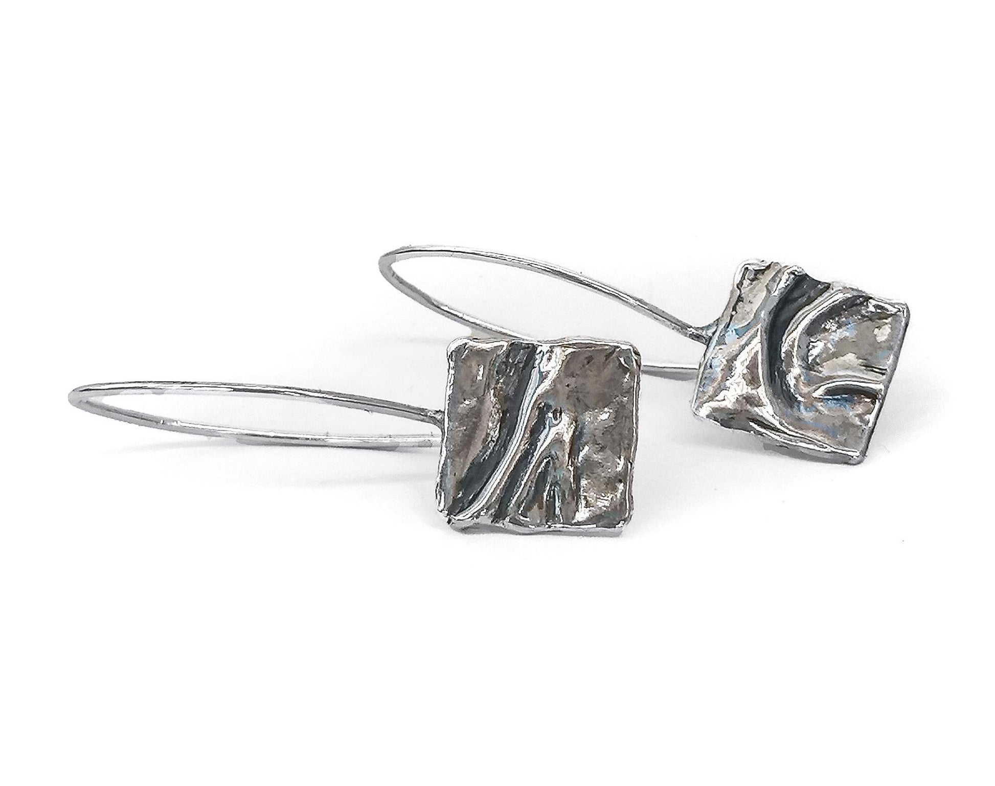 Handmade silver dangle earrings with abstract textured square design