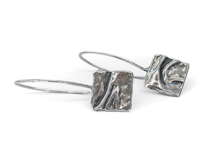 Handmade silver dangle earrings with abstract textured square design