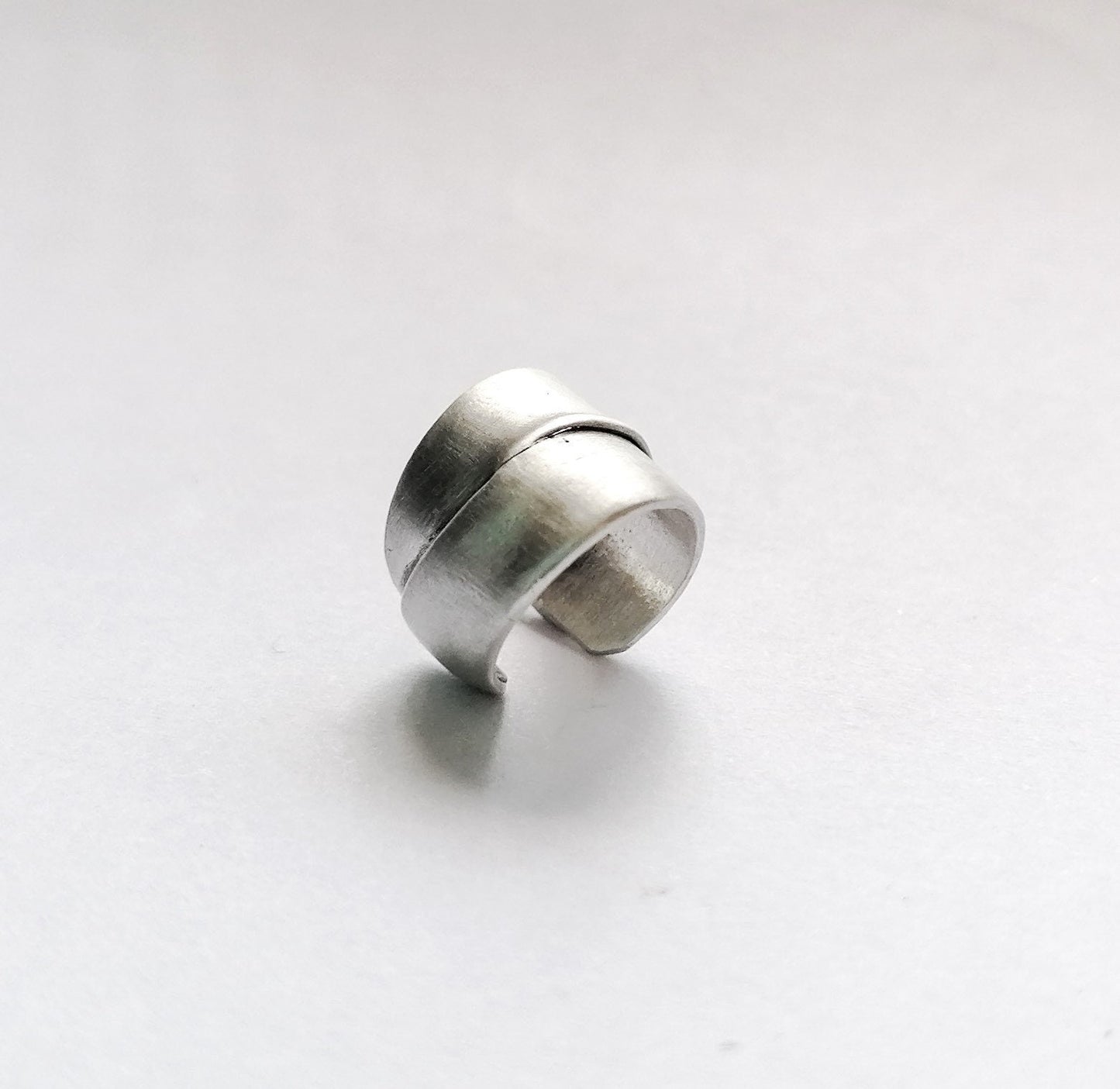 Silver ring on a white background