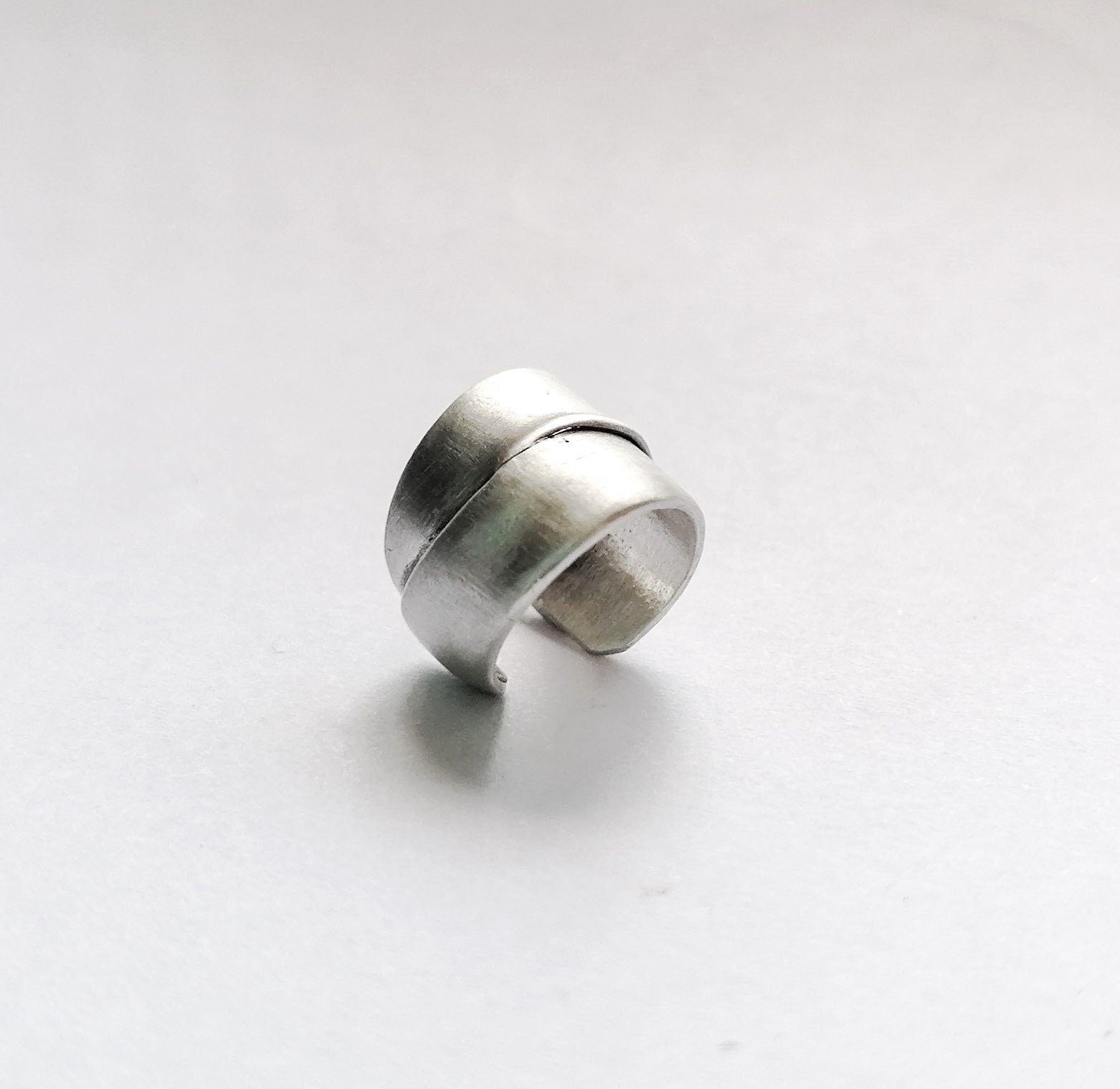 Silver ring on a white background