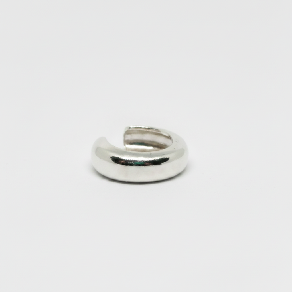 Silver ring on a light gray background