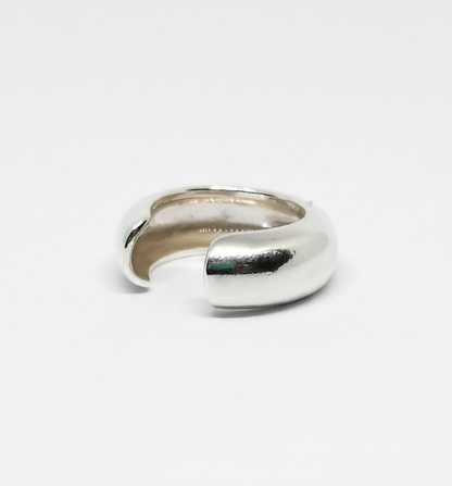 Silver ring on a light gray background