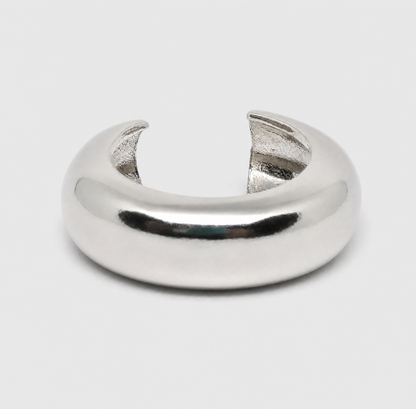 Silver ring with a unique design on a light gray background