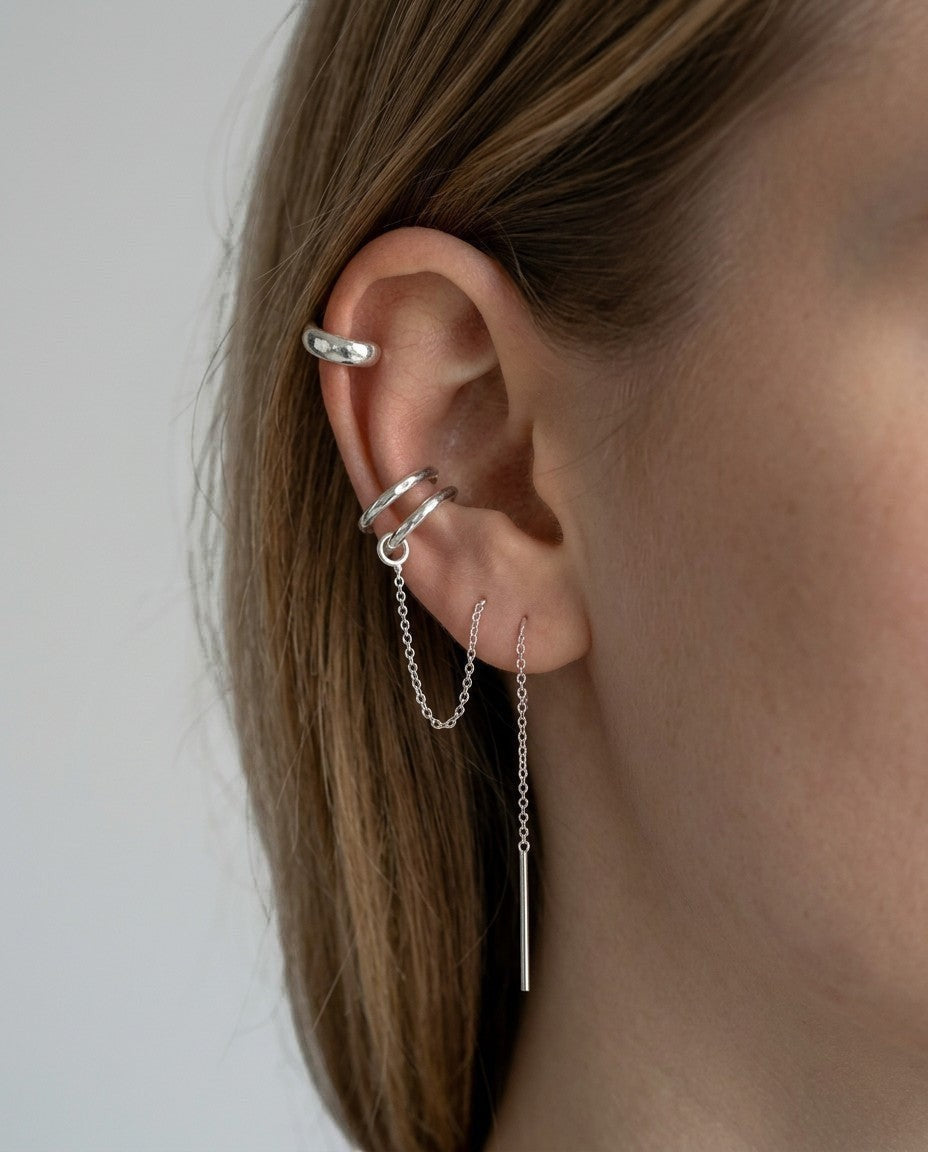 SosyGallery sterling silver 925 conch ear cuff with delicate chain detail worn on a model, no piercing required.