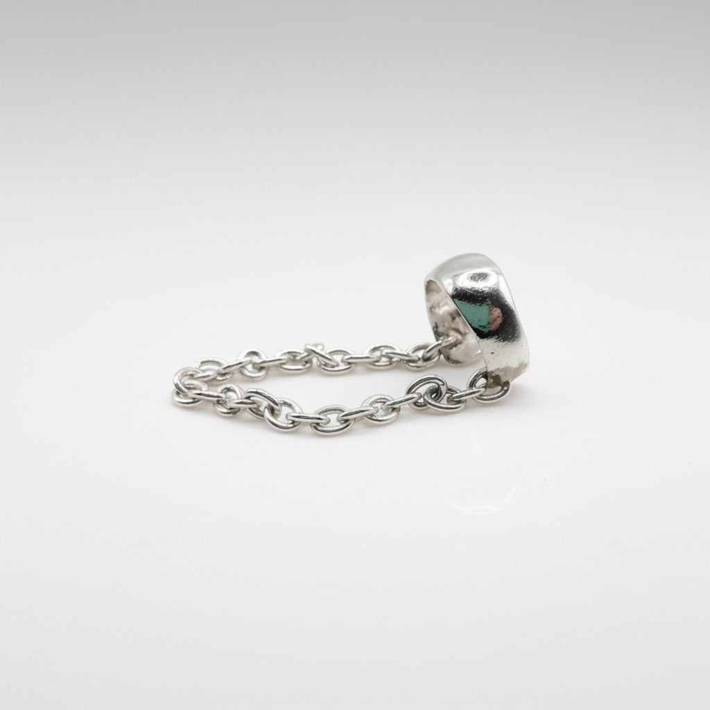 SosyGallery sterling silver conch ear cuff with delicate chain detail, a non-pierced modern jewelry piece.