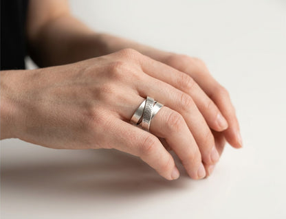SosyGallery wide 925 sterling silver multi-band ring with a brushed finish and textured crosshatch detail on a hand.